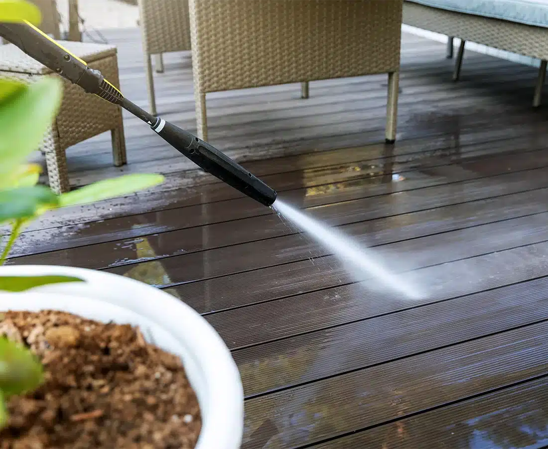 Image 3 of a pressure washer spraying onto a deck | Why 4Everdeck® | 4Everdeck