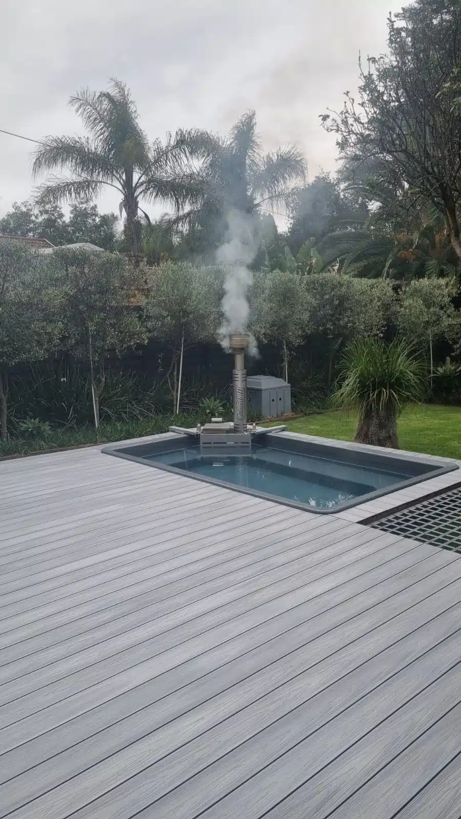 Ash Grey 4 Everdeck® decking around a hot tub in a garden - 2